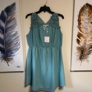 Davi & Dani No Sleeve Dress. Aqua In Color